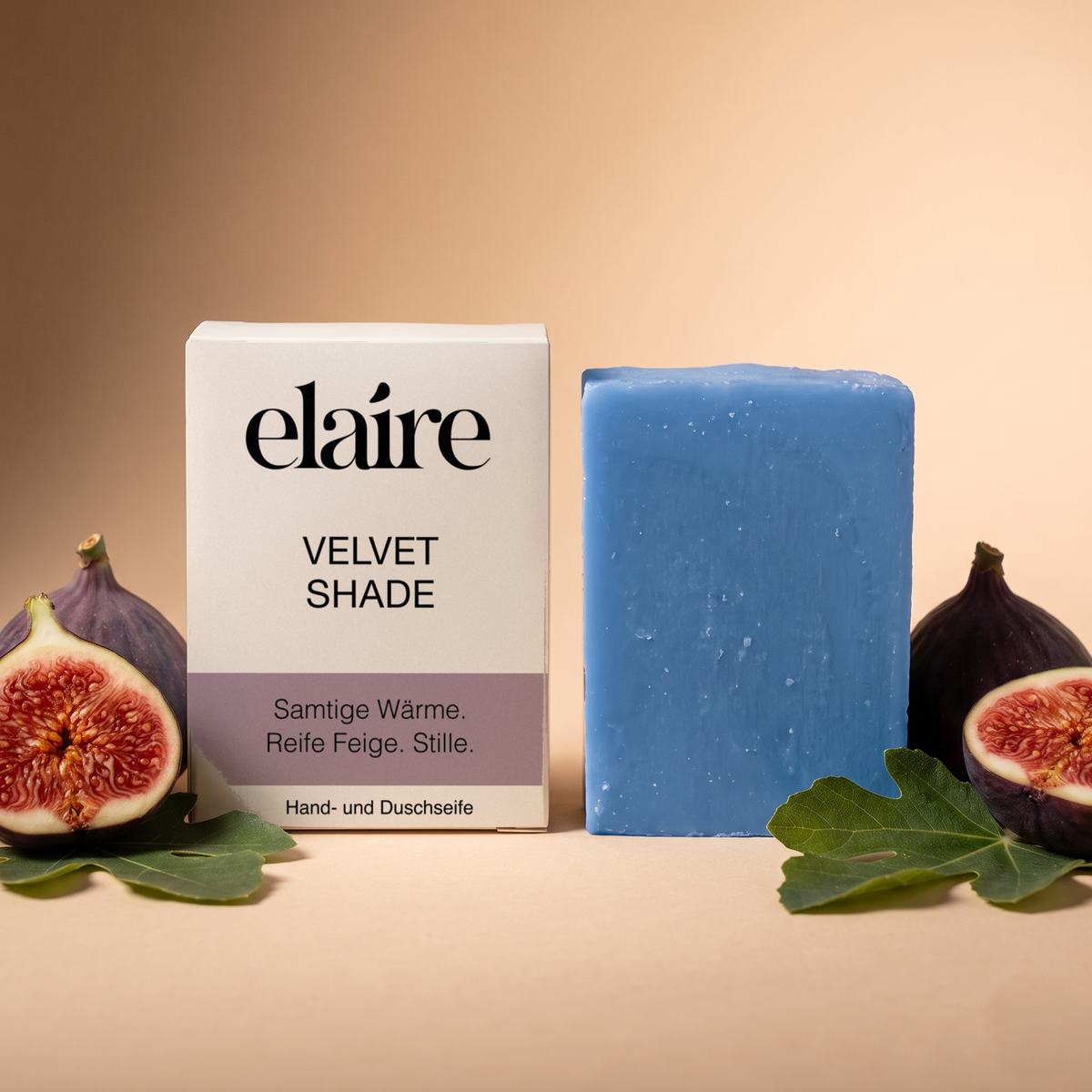 elaire Velvet Shade Hand- und Duschseife mit Schachtel, daneben frische Feigen